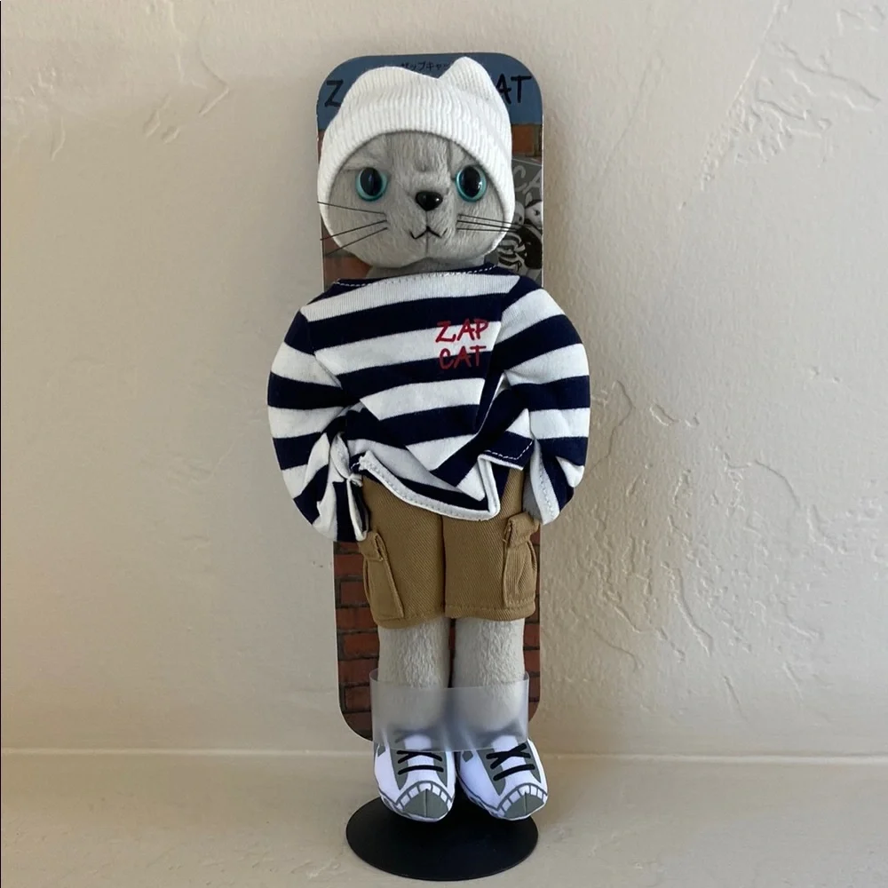 Highly collectible Japanese Zap Cat plush figure. Grey kitty. New on stand.
